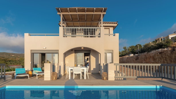 A modern building with a pool, outdoor seating, and a covered patio area. - Aqua Villa II - Entire villa in Elafonisos, Laconia, Greece (Peloponnese)