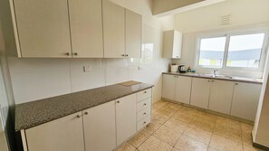 Fridge, electric kettle, toaster, cookware/dishes/utensils - Unique City Center Rooms (Larnaca)