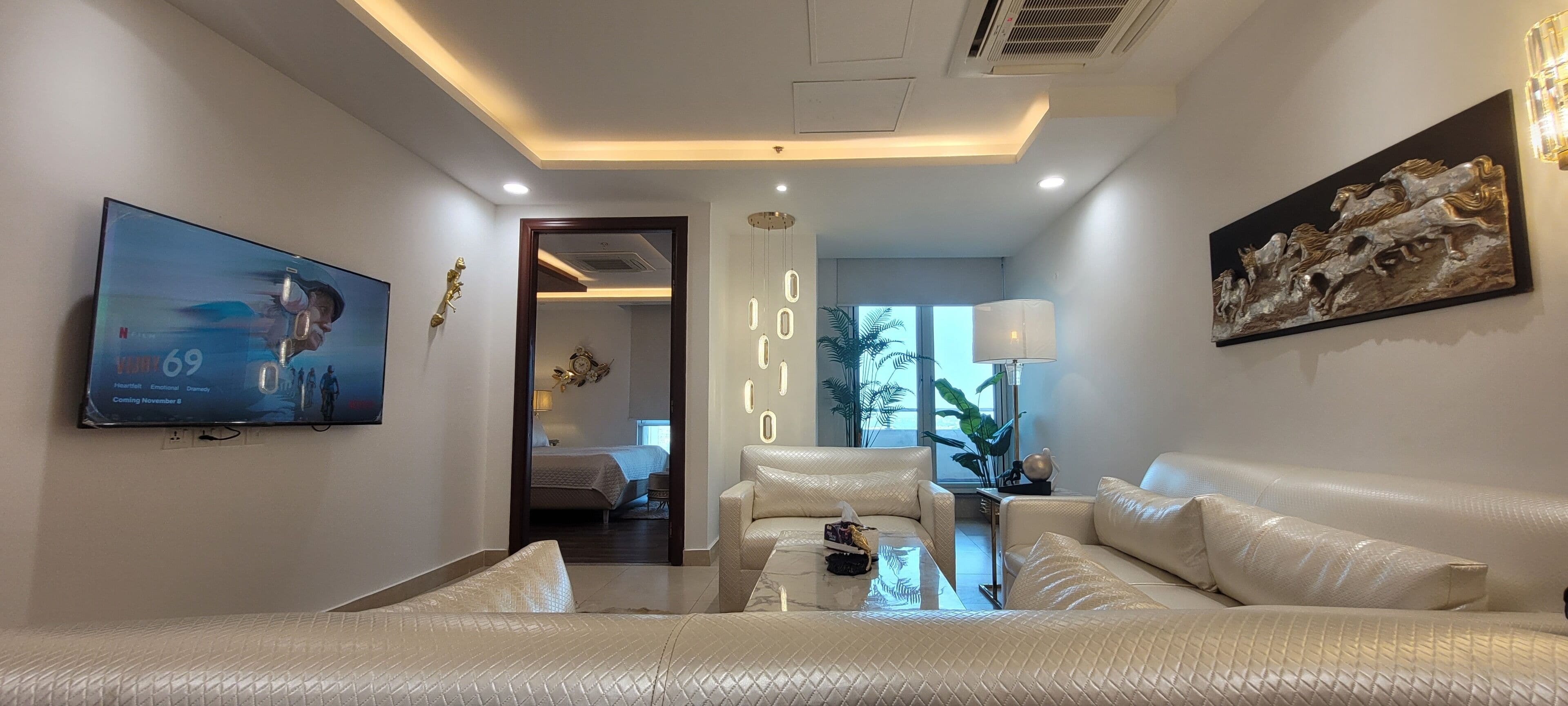 Luxury Apartment, 1 King Bed, City View | Living area | 50-inch LED TV with digital channels, Netflix, streaming services