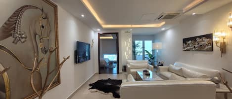 Appartement Luxe, 1 trÚs grand lit, vue ville | Coin séjour