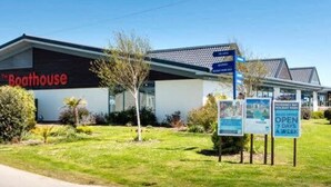 A building labeled "Boathouse" with a sign indicating it is open 7 days a week.