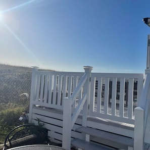 A white deck with a railing, overlooking a hilly landscape. - 74 Bayside Cove Pevensey Bay Holiday Park (Pevensey)