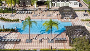 A resort with a swimming pool, sun loungers, and a covered patio area. - Wonderful 12b11 5bath Bella Vida Resort (Kissimmee)