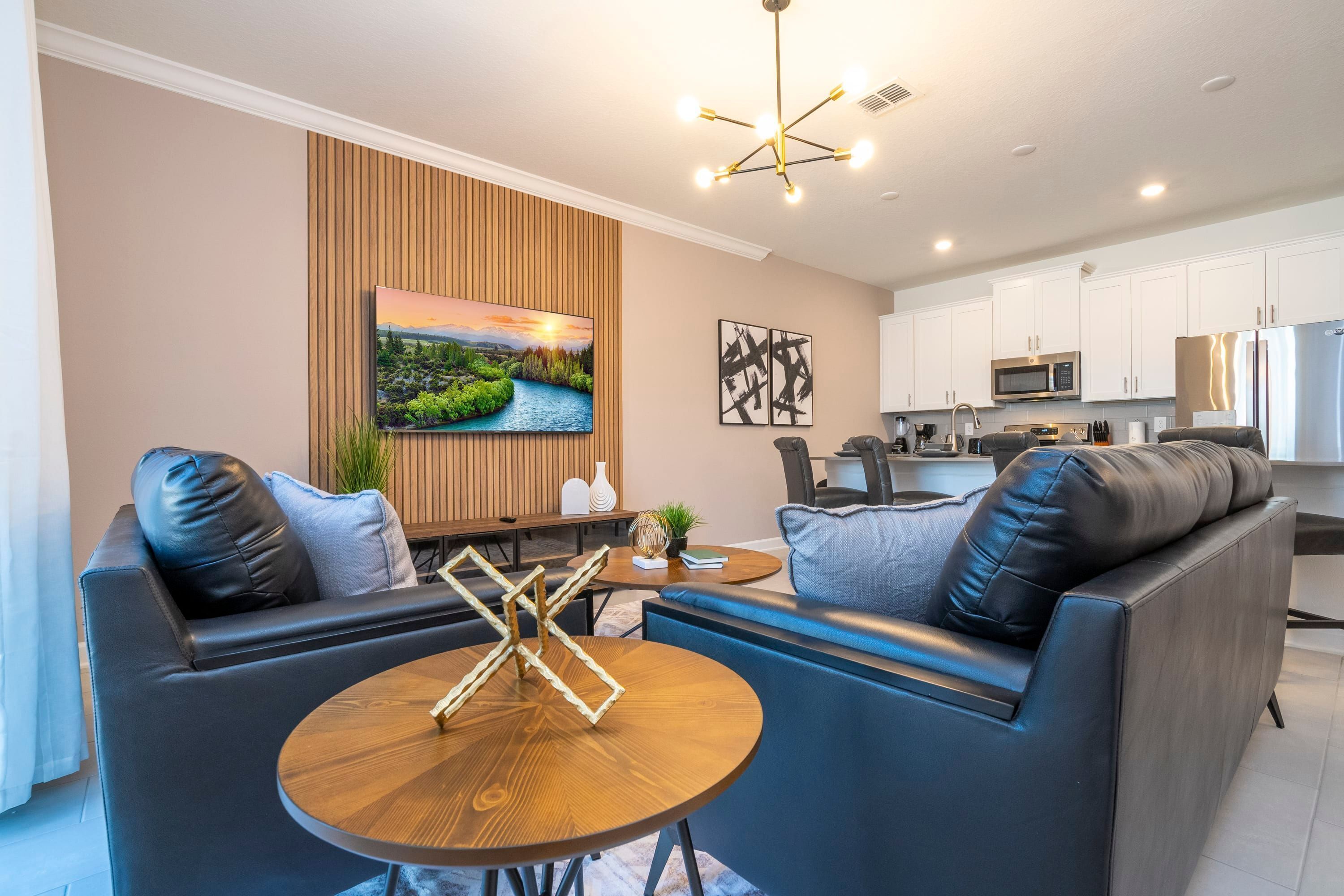 A modern living room with a sofa, coffee table, and TV.