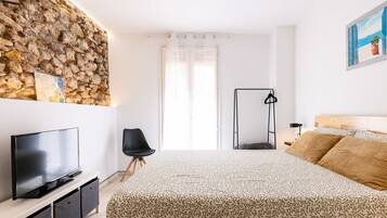 Apartamento | 1 dormitorio y tabla de planchar con plancha