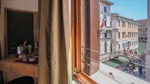 A balcony with a view of a canal, historic buildings, and a bridge. - Residenza San Marco (Venice)