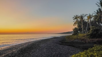 On the beach, black sand, fishing