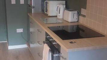 Oven, coffee/tea maker, toaster, cookware/dishes/utensils