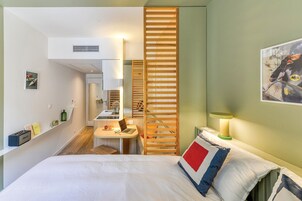 Premium bedding, pillowtop beds, laptop workspace, soundproofing