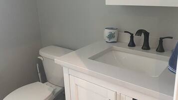 Shower, towels, soap, toilet paper