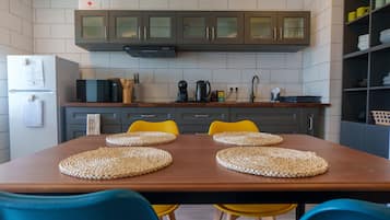Fridge, microwave, cookware/dishes/utensils, dining tables