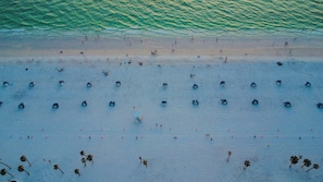 Enjoy a well-organized beach with a gentle slope and calm waters, perfect for swimming.