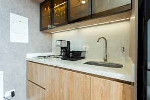 Fridge, microwave, stovetop, coffee/tea maker