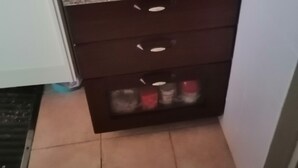 A small kitchenette with a countertop, a sink, and a cabinet below. - Serraona triple room with bathroom (ALGHERO)
