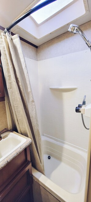 Shower, eco-friendly toiletries, towels, soap