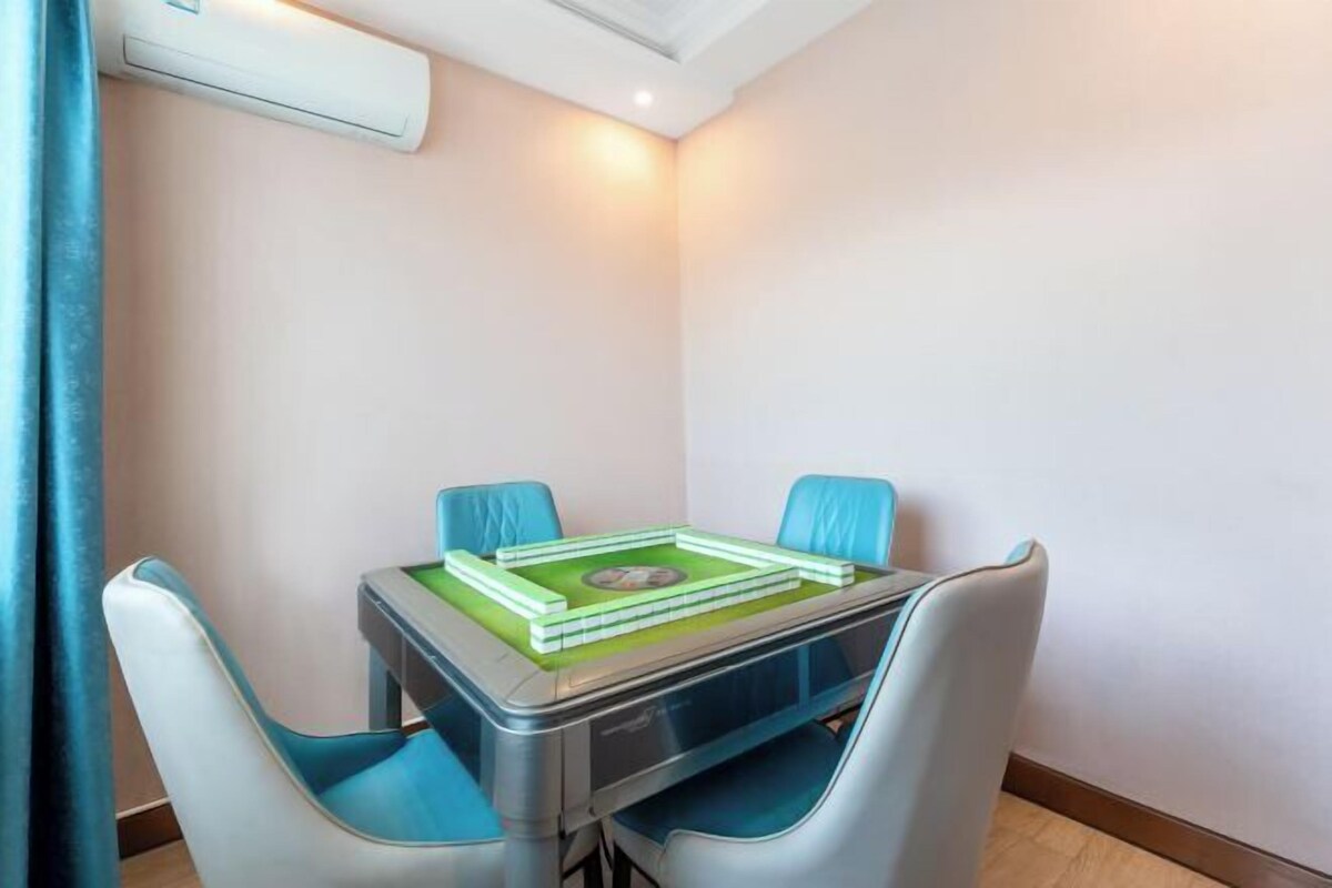 A compact room with a small table and two chairs.