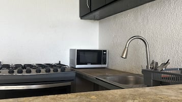 Microwave, oven, stovetop, cookware/dishes/utensils