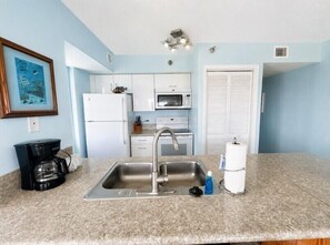 Coffee/tea maker, fridge, microwave, oven