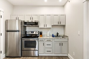 Family Apartment | Private kitchen | Full-size fridge, microwave, oven, stovetop