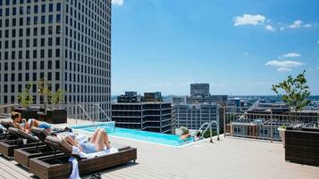 Outdoor pool, open 7:00 AM to 11:00 PM, pool loungers