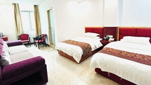 A hotel room with two beds, a sofa, a desk, and a chair. - Taiyuan Hostel (Dabu)