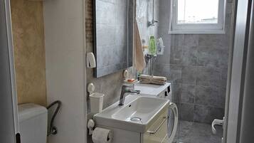 Shower, eco-friendly toiletries, hair dryer, towels
