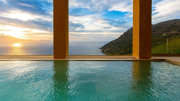 An infinity pool with a view of the sea and a sunset. - Athina Epavlis - Ethereal Charm of Blue Horizons (Platanias)