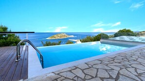 A swimming pool with a view of the sea and an island. - Coastal Paradise Found - Komis Private Pool Gem (Zakynthos)