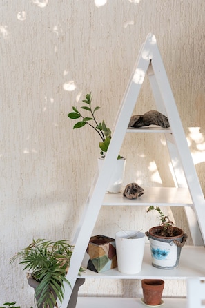 A white ladder with three shelves holding various potted plants. - Mear Luxury Suite - The Ultimate Summer Nest (Kantanos-Selino)