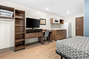 Suite, 1 Queen Bed, Non Smoking | Laptop workspace, blackout drapes, bed sheets