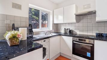 Apartment | Private kitchen | Fridge, microwave, oven, stovetop