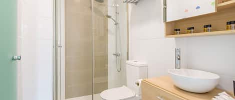 Shower, hair dryer, towels, toilet paper