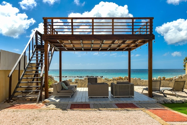 Enjoy meals with the soothing sounds of the sea as your backdrop