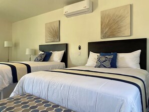 Deluxe Quadruple Room | Minibar, blackout curtains, iron/ironing board, free WiFi