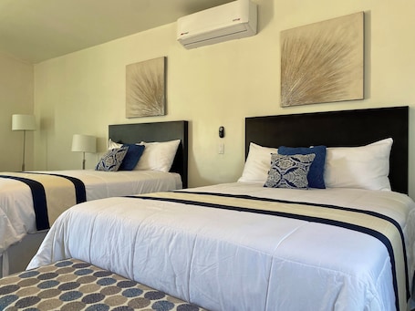 Deluxe Quadruple Room | Minibar, blackout drapes, iron/ironing board, free WiFi