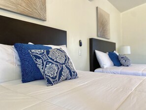 Chambre Quadruple Deluxe | Minibar, rideaux occultants, fer et planche à repasser, Wi-Fi gratuit