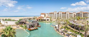 Swim-up bar, private beach, infinity pool, and Greg Norman-designed golf course