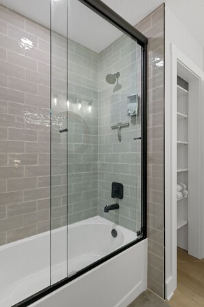 Shower, hair dryer, towels, soap