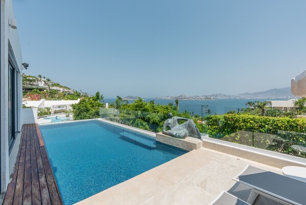 Outdoor pool, pool umbrellas, pool loungers