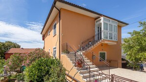 A two-story building with a staircase leading to the upper floor. - Gorgeous apartment in Novi Vinodolski with WiFi (Novi Vinodolski)