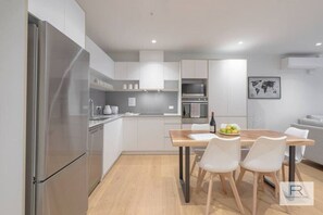 Fridge, microwave, oven, stovetop - Beautiful Garden Apartment| by Furnished Rentals (Auckland)