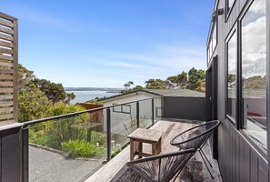 Deck with stunning views - Cosy Tiny Home with Ocean Views|by Furnished Rentals (Auckland)