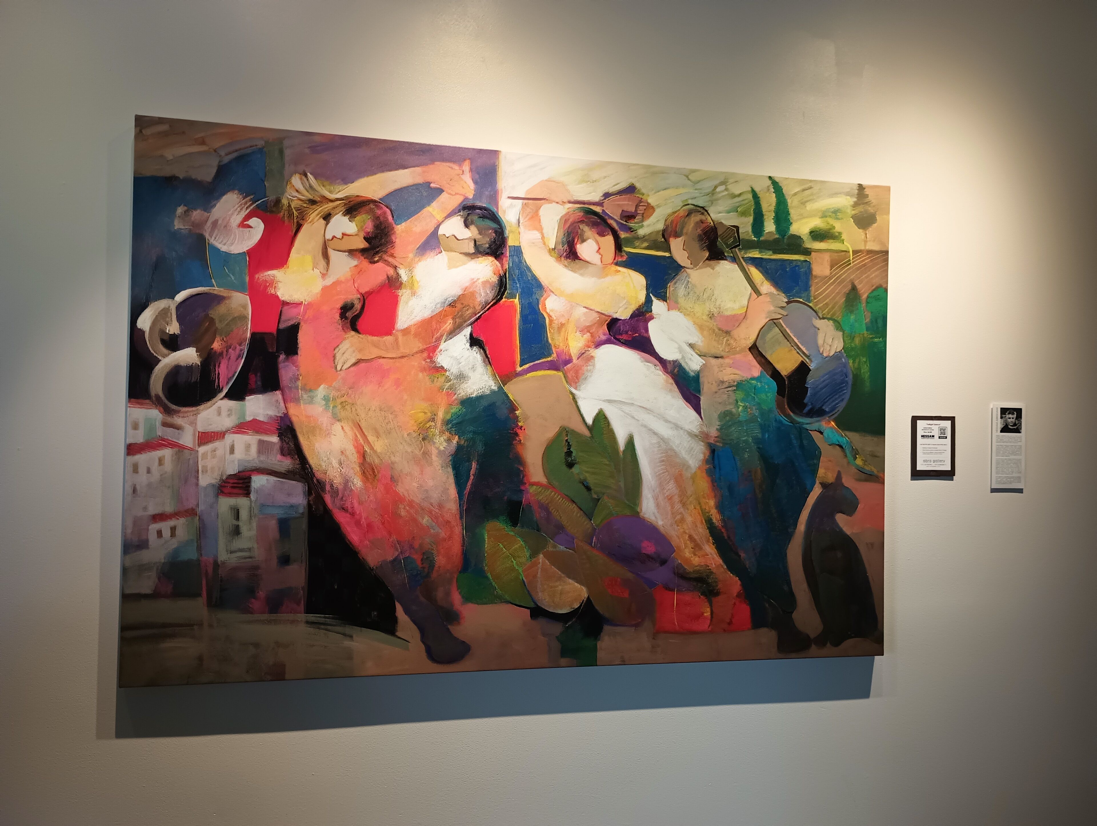 A large abstract painting on a wall.