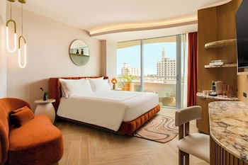 Room, 1 King Bed, Balcony, Partial Ocean View | Minibar, in-room safe, blackout drapes, iron/ironing board at UNFRAMED, Autograph Collection