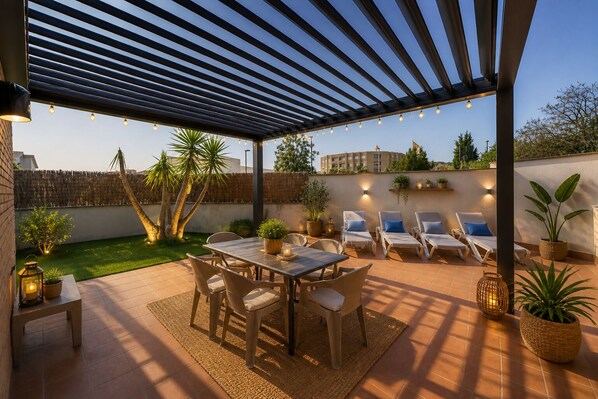 An outdoor patio with a pergola, seating area, and potted plants.
