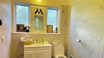 Shower, hair dryer, towels, soap
