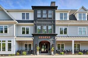 A multi-story hotel with a central entrance, large windows, and a prominent sign. - Brookmere Saratoga, a Tribute Portfolio Hotel  (Saratoga Springs)