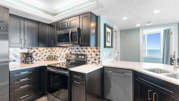 Coffee/tea maker, fridge, microwave, oven