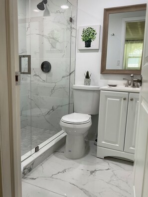 Shower, hair dryer, towels, soap