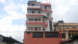 A multi-story building with a sign reading "HOTEL AAKANSH". - Hotel Aakansh (Sainbu)